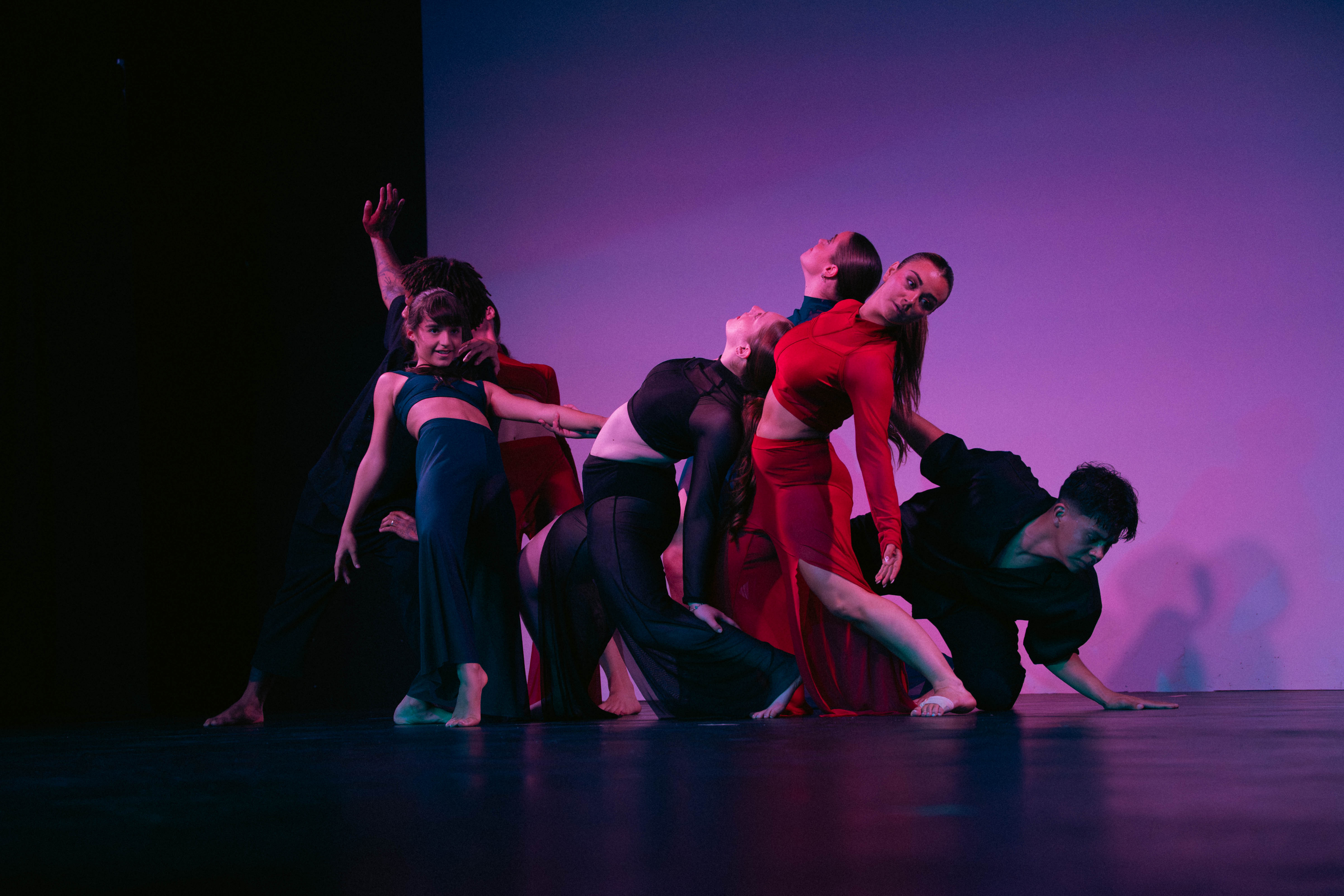 VelaDance dancers intertwined in a group contemporary piece — South Jersey dance company performance