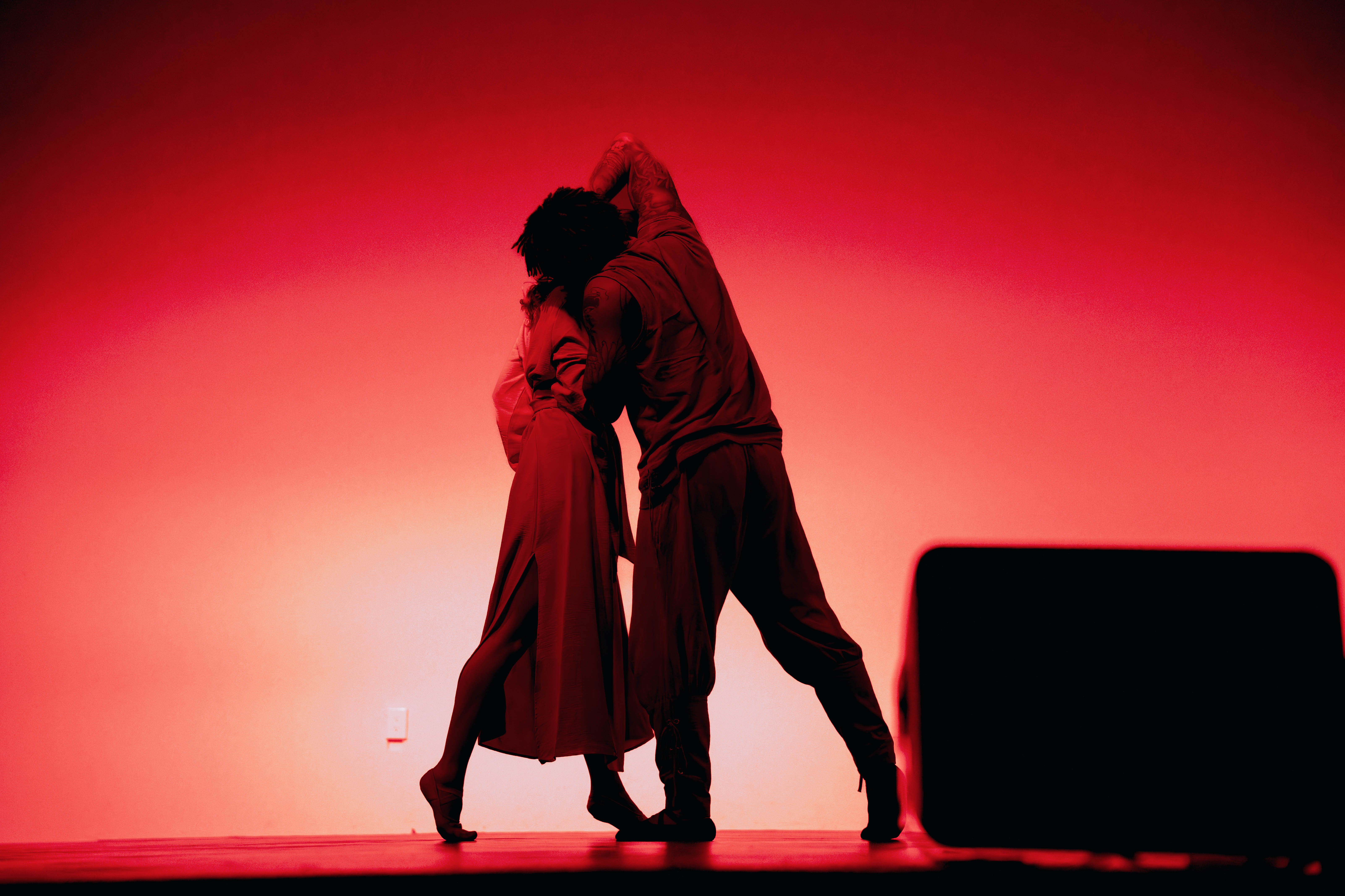VelaDance duet in dramatic red stage light — South Jersey based dance company