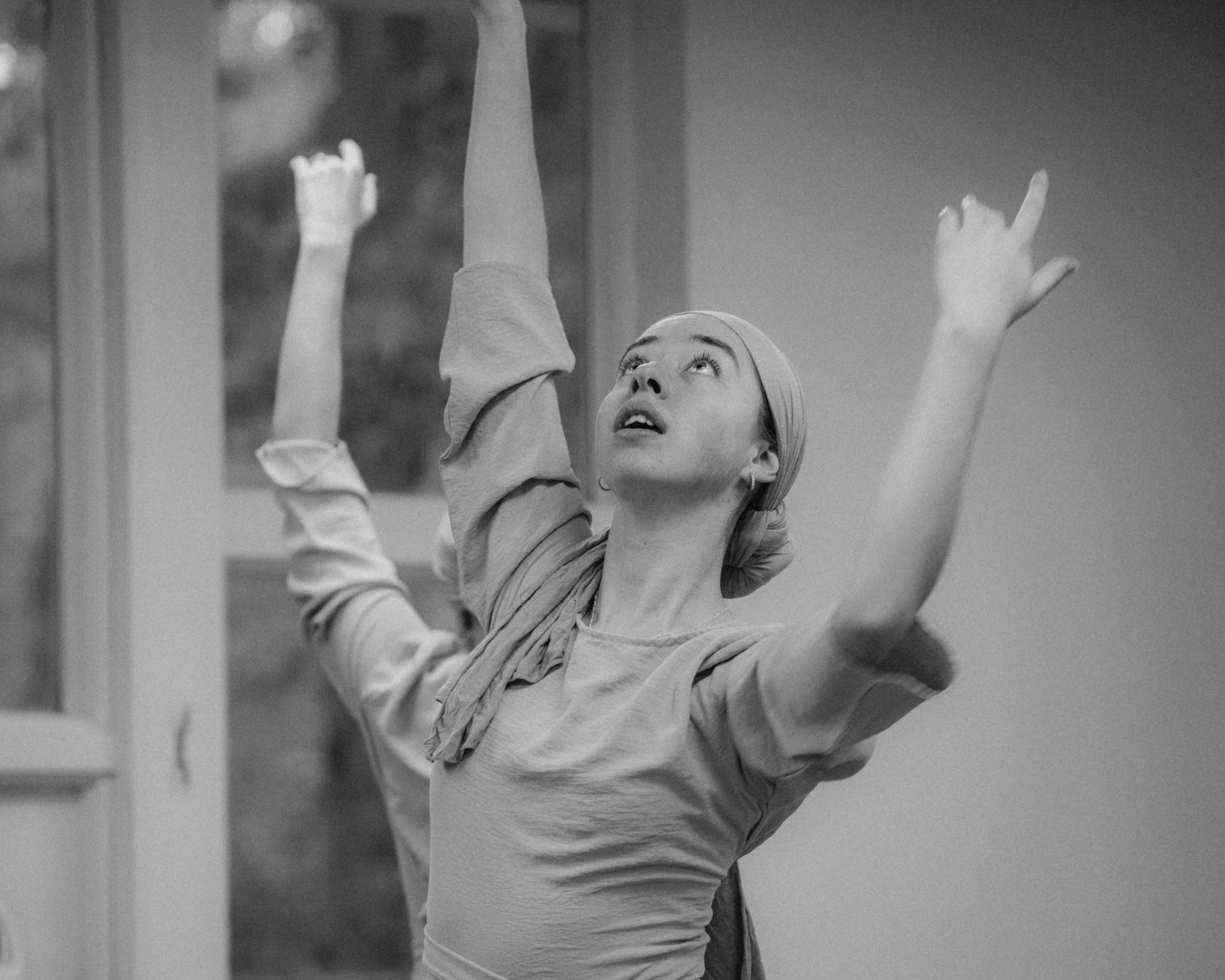 VelaDance dancer reaching upward in studio rehearsal — professional contemporary dance company South Jersey
