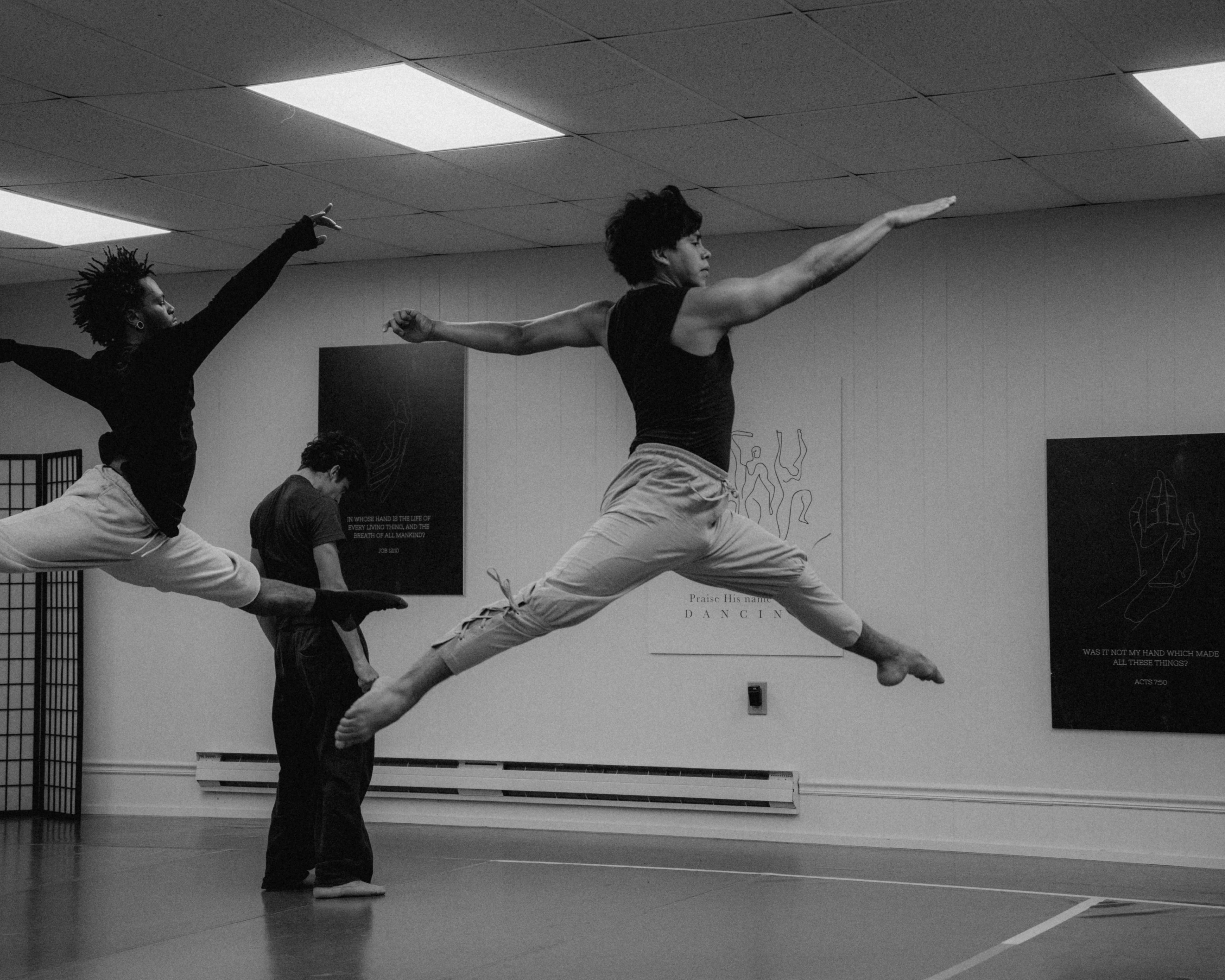 VelaDance dancers in twin mid-air leaps at rehearsal — concert dance company South Jersey